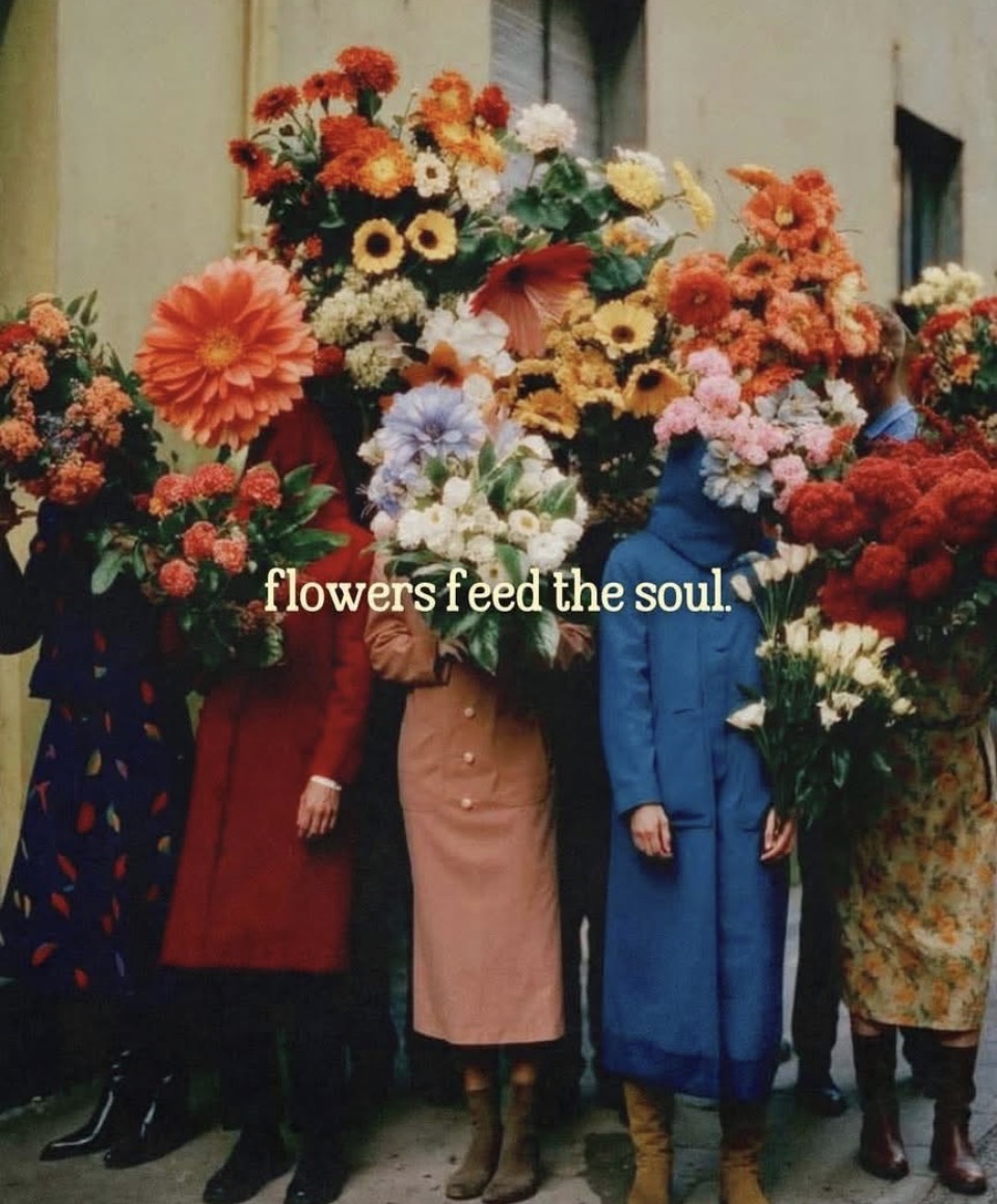 People standing with vibrant flower bouquets and the phrase flowers feed the soul