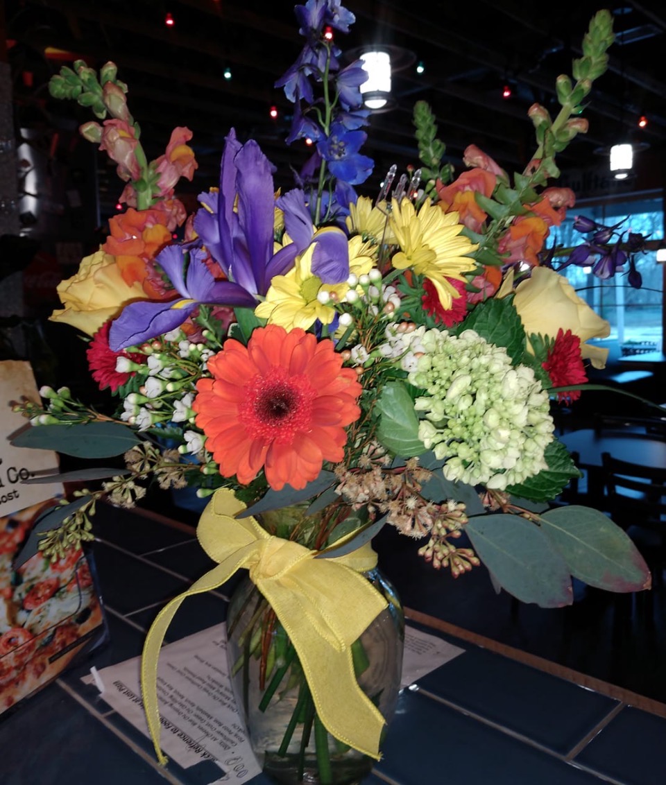 Red daisies and yellow yarrow wildflower bunch